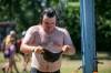 BROOK JONES / FREE PRESS
                                Folk Fest attendee Miles Bruns, 32, from Madison, Wis., tries to keep cool on an extremily hot summer day by filling up his bucket hat with water from an outdoor shower at Birds Hill Provincial Park, Sunday.