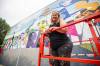 MIKAELA MACKENZIE / FREE PRESS Mandy Van Leeuwen is about four weeks into the expected six-week Folklorama mural project.