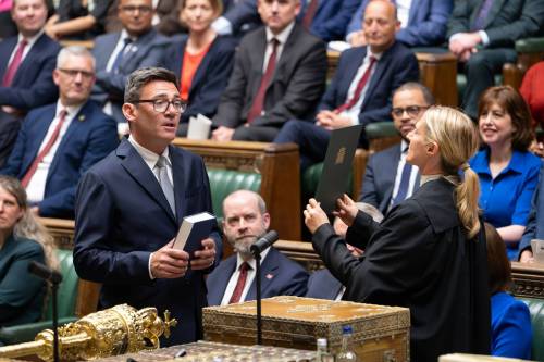 House of Commons via AP
                                Andy Burnham, front left, is sworn-in as an MP in the House of Common in London, England, on June 22.
