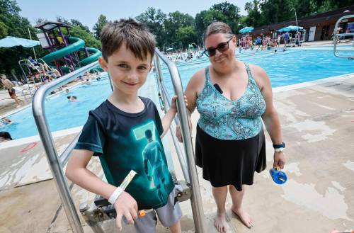 JOHN WOODS / FREE PRESS
                                Logan and his mother Ashley Shepherd at a National Drowning Prevention Week event hosted by the Lifesaving Society at Kildonan Park Sunday, July 19, 2026. reporter: morgan