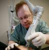 JOHN WOODS / CANWEST NEWS SERVICE FILES
                                Dr. Earl Minuk administers laser treatment to a patient in 2009.