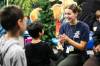 MIKAELA MACKENZIE / FREE PRESS
                                Hayley Toet plays clapping games with the kids at the Inner City Youth Alive vacation bible school day camp.