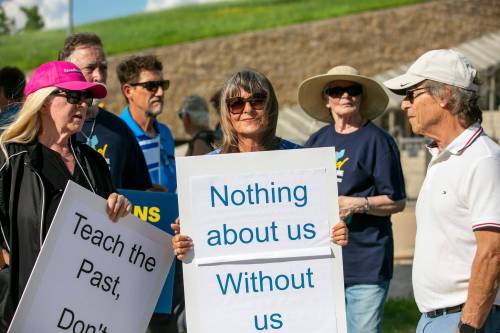 BROOK JONES/FREE PRESS FILES
                                Protesters gather outside of the Canadian Museum for Human Rights over the current Nakba exhibit. Gail Asper (centre), whose late father Izzy Asper founded the museum, holds a sign.