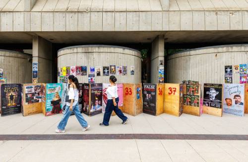 MIKE DEAL / FREE PRESS 
                                Fringe festival posters and sandwich boards line the sidewalk along Market Avenue beside the Royal Manitoba Theatre Centre.