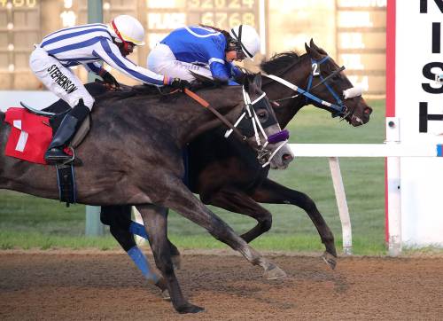 Jason Halstead / Assiniboia Photo
                                Jockey Ciera Pruitt and Bromeo (inside) hold off Silver Spiced to win the Frank Arnason Sire Stakes on Tuesday at ASD.