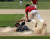 Cassidy Dankochik / Carillon
                                Brady Papineau is caught in a rundown during the first inning of Carillon&rsquo;s 15-5 mercy rule victory over Elmwood at A.D. Penner Park in Steinbach on Friday.