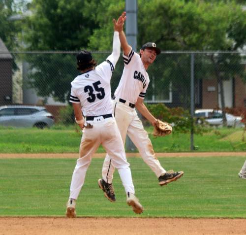 CASSIDY DANKOCHIK / THE CARILLON
                                Carillon shortstop Cedric Lagasse (facing camera) and second baseman Cody Wielgosh (#35) celebrate following their team&rsquo;s 12-0 win over Elmwood July 26, 2026, at Koskie Field in Winnipeg in game two of the MJBL finals.