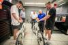 MIKAELA MACKENZIE / FREE PRESS Thomas Clark (left) and Val Duquenne greet Canadian Tire folks Brad Elliott (left), Marc Gaudreau, and Chris Coenen with their new bikes on Monday.