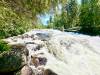 Photo by Gord Mackintosh
                                Rushing River Provincial Park&rsquo;s roadside rapids.