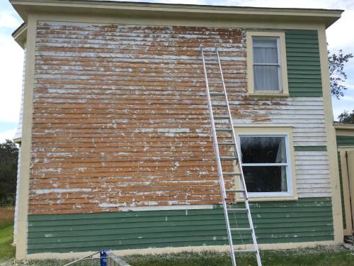 Russell Wangersky / Free Press
                                A house and a ladder. Just add water, electricity and a power washer, and you&rsquo;ve got all the ingredients of a bad idea.