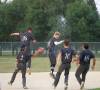 CASSIDY DANKOCHIK / THE CARILLON
                                Carillon Sultans right fielder Joe Plett is mobbed by teammates after driving home the championship-winning run in the MJBL final against the Elmwood Giants in Steinbach on Tuesday night.