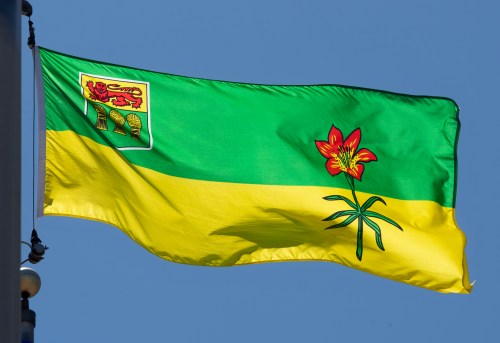 Saskatchewan says investigators are looking into the death of two people in the province's north who are suspected of being killed by wildlife. Saskatchewan's provincial flag flies on a flag pole in Ottawa, Monday, July 6, 2020.THE CANADIAN PRESS/Adrian Wyld