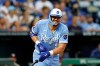 Kansas City Royals' Vinnie Pasquantino reacts after injuring a hand during an at-bat in the seventh inning of a baseball game against the Houston Astros in Kansas City, Mo., Saturday, June 13, 2026. (AP Photo/Colin E. Braley)