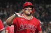 Los Angeles Angels' Mike Trout (27) reacts after hitting a two-run home run against the Arizona Diamondbacks in the fifth inning of a baseball game, Tuesday, June 16, 2026, in Phoenix. (AP Photo/Rick Scuteri)