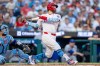 Philadelphia Phillies' Kyle Schwarber, right, hits a three-run home run during the second inning of a baseball game against the New York Mets, Sunday, June 21, 2026, in Philadelphia. (AP Photo/Chris Szagola)