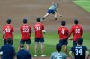 Rintaro Sasaki, of Japan, a first baseman at Stanford, fields a grounder as other players wait their turn at the MLB baseball combine in Phoenix, Tuesday, June 23, 2026. (AP Photo/Ross D. Franklin)