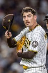 San Diego Padres relief pitcher Ron Marinaccio walks off the field after being pulled in the eighth inning of a baseball game against the Los Angeles Dodgers, Saturday, June 27, 2026, in San Diego. (AP Photo/Tony Ding)