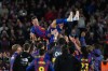 FILE - Barcelona's Robert Lewandowski is thrown into the air by his teammates after his last game for the club at the end of the Spanish La Liga soccer match between FC Barcelona and Real Betis in Barcelona, Spain, May 17, 2026. (AP Photo/Joan Mateu Parra, File)