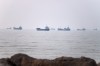 Commercial vessels are seen in the Strait of Hormuz off Bandar Abbas, Iran, Tuesday, June 30, 2026. (Amirhosein Khorgooi/ISNA via AP)