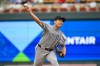 Colorado Rockies pitcher Tomoyuki Sugano throws against the Minnesota Twins during the first inning of a baseball game Friday, June 26 2026, in Minneapolis. (AP Photo/Craig Lassig)