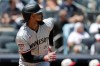 Minnesota Twins' Byron Buxton watches his run scoring double during the first inning of a baseball game against the New York Yankees, Saturday, July 4, 2026, in New York. (AP Photo/Adam Hunger)