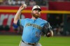 Milwaukee Brewers pitcher Brandon Woodruff works against the Arizona Diamondbacks during the first inning of an baseball game Saturday, July 4, 2026, in Phoenix. (AP Photo/Darryl Webb)