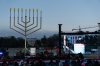 FILE - Rabbi Levi Shemtov speaks to the crowd before he lights the Menorah during the annual National Menorah Lighting in celebration of Hanukkah, on the Ellipse near the White House in Washington, Dec. 14, 2025. (AP Photo/Jose Luis Magana, File)