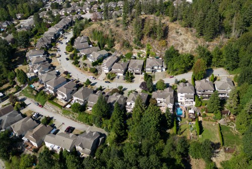 Houses are seen in a neighbourhood on the side of a mountain, in Maple Ridge, B.C., on Thursday, Aug. 17, 2023. THE CANADIAN PRESS/Darryl Dyck