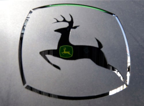 FILE - A John Deer emblem is seen at the Husker Harvest Days farm show in Wood River, Neb., Sept. 12, 2018. (AP Photo/Nati Harnik, File)
