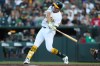 Athletics' Nick Kurtz hits a two-run home run during the third inning of a baseball game against the Miami Marlins, Friday, July 3, 2026, in West Sacramento, Calif. (AP Photo/Scott Marshall)
