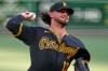 Pittsburgh Pirates pitcher Jared Jones delivers during the first inning of a baseball game against the Atlanta Braves in Pittsburgh, Wednesday, July 8, 2026. (AP Photo/Gene J. Puskar)