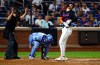 New York Mets' Jared Young reacts after being hit by a pitch during the eighth inning of a baseball game against the Kansas City Royals, Wednesday, July 8, 2026, in New York. (AP Photo/Noah K. Murray)