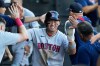 Boston Red Sox's Tsung-Che Cheng of Taiwan, celebrates with teammates after scoring on a one-run double by Ceddanne Rafaela during the third inning of a baseball game against the Chicago White Sox in Chicago, Wednesday, July 8, 2026. (AP Photo/Nam Y. Huh)