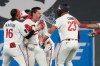 Minnesota Twins' Alan Roden, center left, celebrates with teammates after hitting a walk-off RBI single scoring Royce Lewis in the ninth inning of a baseball game against the Cleveland Guardians, Wednesday, July 8, 2026, in Minneapolis. (AP Photo/Joseph Scheller)