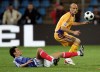 FILE - France's Yoann Gourcuff challenges for the ball with Romania's Gabriel Muresan, right, during their World Cup group 7 qualifying soccer match at Farul Stadium in Constanta, Romania Saturday Oct. 11, 2008. (AP Photo/Francois Mori, File)