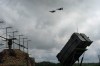FILE - Ukrainian Air Force's F-16 fighter jets fly over a Patriot Air and Missile Defense System in an undisclosed location in Ukraine, on Aug. 4, 2024. (AP Photo/Efrem Lukatsky, File)