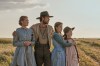 This image released by Netflix shows, from left, Crosby Fitzgerald as Caroline Ingalls, Luke Bracey as Charles Ingalls, Skywalker Hughes as Mary Ingalls, and Alice Halsey as Laura Ingalls in a scene from 