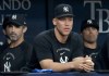 New York Yankees' Aaron Judge watches from the dugout during a baseball game against the Tampa Bay Rays Monday, July 6, 2026, in St. Petersburg, Fla. (AP Photo/Jason Behnken)
