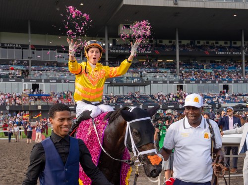 Jockey Pietro Moran celebrates aboard Mansetti after winning the King's Plate horse race, in Toronto, Saturday, Aug. 16, 2025. THE CANADIAN PRESS/Frank Gunn