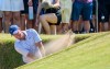 Rory McIlroy, of Northern Ireland, plays from a bunker on the ninth fairway during day one of the Genesis Scottish Open 2026 at The Renaissance Club in North Berwick, Scotland, Thursday, July 9, 2026. (Malcolm Mackenzie/PA via AP)
