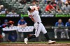 Baltimore Orioles right fielder Tyler O'Neill (9) follows through on a solo home run against the Chicago Cubs in the second inning of a baseball game, Thursday, July 9, 2026 in Baltimore. (AP Photo/Gail Burton)