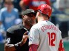 Philadelphia Phillies' Kyle Schwarber, right, argues with home plate umpire Alan Porter, left, after a called strike for an out to end the side during the sixth inning of a baseball game against the Kansas City Royals in Kansas City, Mo., Monday, July 6, 2026. (AP Photo/Colin E. Braley)