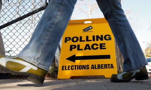 A voter enters a polling station in Calgary, Tuesday, May 5, 2015.THE CANADIAN PRESS/Jeff McIntosh