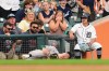 Athletics left fielder Zack Gelof grabs his leg after contacting the wall while catching a Detroit Tigers' Zach McKinstry fly ball in foul territory during the third inning of a baseball game Thursday, July 9, 2026, in Detroit. (AP Photo/Paul Sancya)