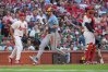 Milwaukee Brewers' Garrett Mitchell, center, scores between St. Louis Cardinals starting pitcher Andre Pallante, left, and catcher Iván Herrera during the third inning of a baseball game Thursday, July 9, 2026, in St. Louis. (AP Photo/Jeff Roberson)