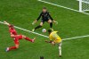 Colombia's Jaminton Campaz (21) misses a shot on goal as Switzerland goalkeeper Gregor Kobel (1) defends during the World Cup round of 16 soccer match in Vancouver, British Columbia, Tuesday, July 7, 2026. (AP Photo/Gregory Bull)