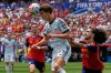Belgium's Charles De Ketelaere (17) challenges for the ball with Spain's Marc Cucurella (24) during the World Cup quarterfinal soccer match between Spain and Belgium in Inglewood, Calif., near Los Angeles, Friday, July 10, 2026. (AP Photo/Gregory Bull)