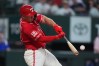 Texas Rangers' Wyatt Langford hits a home run during the 8th inning of a baseball game against the Houston Astros, Friday, July 10, 2026, in Arlington, Texas. (AP Photo/LM Otero)