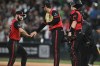 Chicago White Sox's Tristan Peters, left, celebrates with closing pitcher Tyler Davis, center, after defeating the Athletics in a baseball game in Chicago, Friday, July 10, 2026. (AP Photo/Paul Beaty)