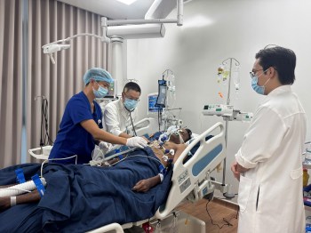 An Indian tourist, who was rescued from a speedboat that capsized, receives treatment at a hospital in Phu Quoc, Vietnam, Saturday, July11, 2026. (Le Huy Hai/VNA via AP)